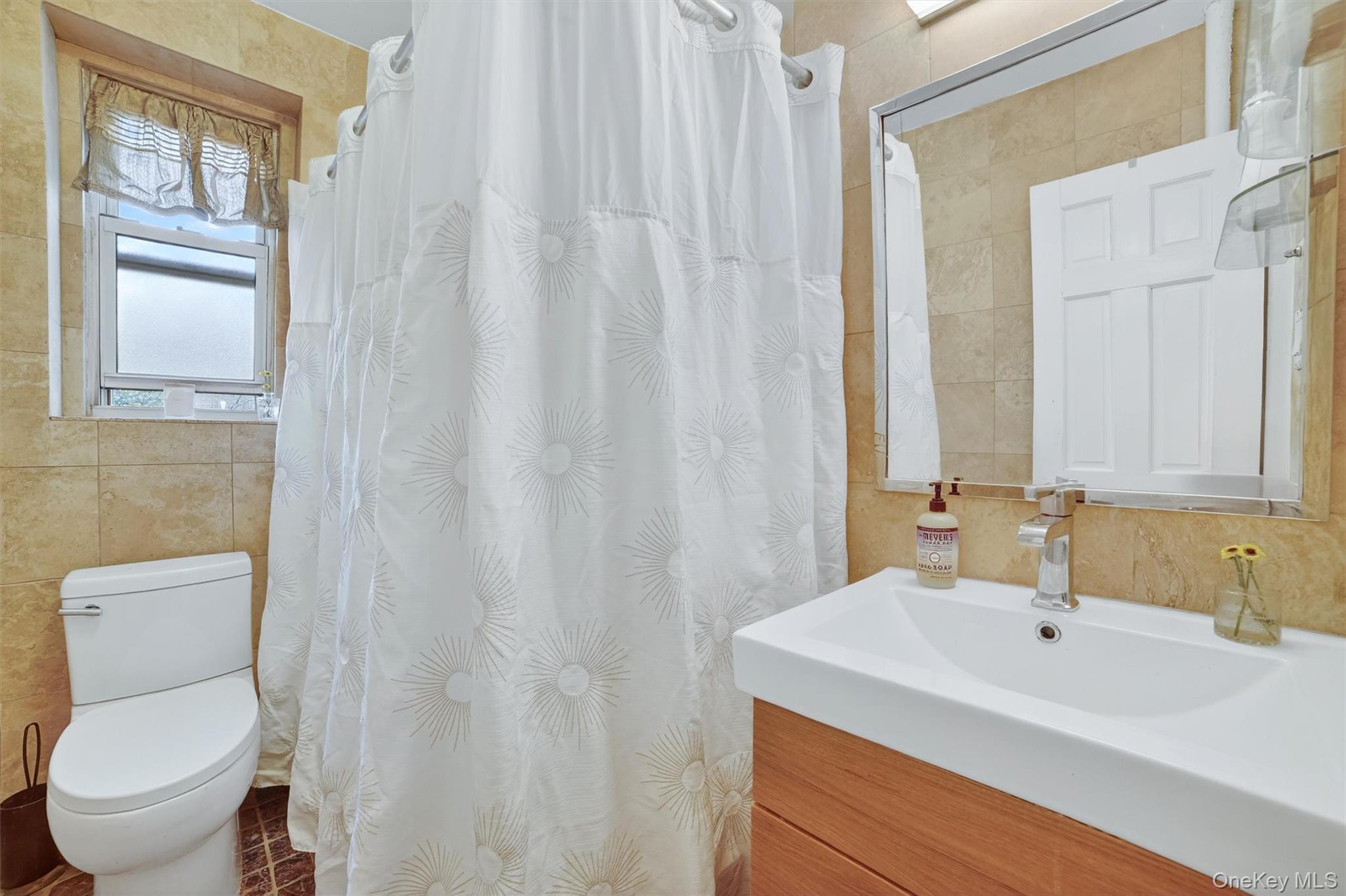 824 Palmer Road, Unit 2D Bronxville, NY 10708 - Photo 23 of 29 a bathroom with a sink a toilet and a window