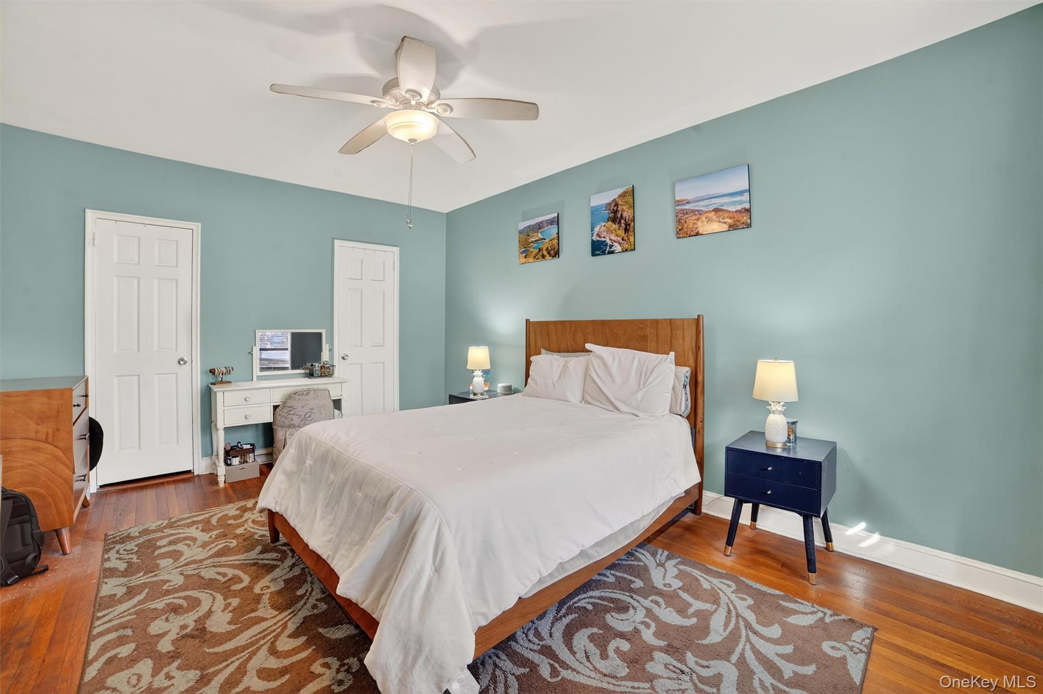 824 Palmer Road, Unit 2D Bronxville, NY 10708 - Photo 25 of 29 a bedroom with a bed and a chandelier