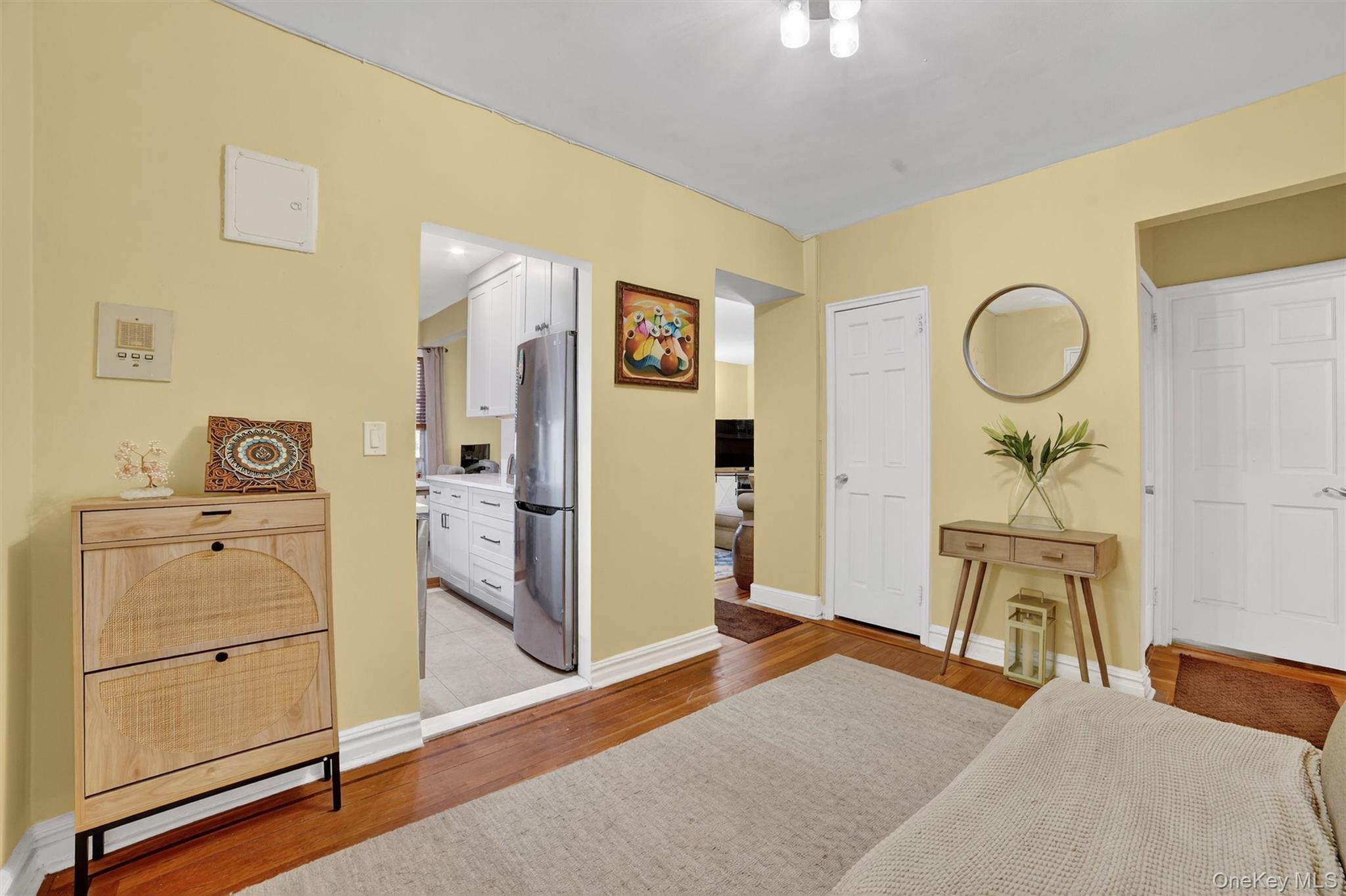 824 Palmer Road, Unit 2D Bronxville, NY 10708 - Photo 10 of 29 a bedroom with a bed and a chandelier