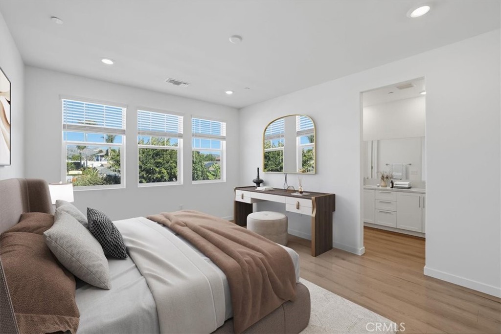 2378 Channel Drive, Unit 103 Ventura, CA 93003 - Photo 14 of 33 a bedroom with a bed and a large window