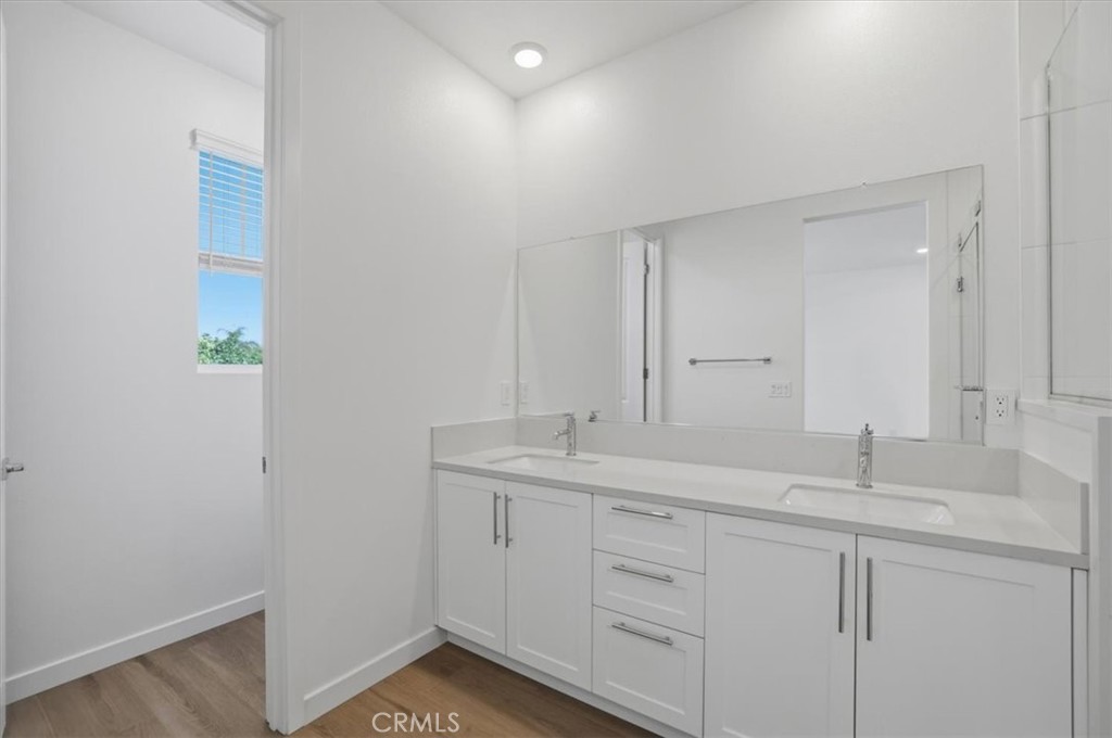 2378 Channel Drive, Unit 103 Ventura, CA 93003 - Photo 17 of 33 a bathroom with a sink and a mirror