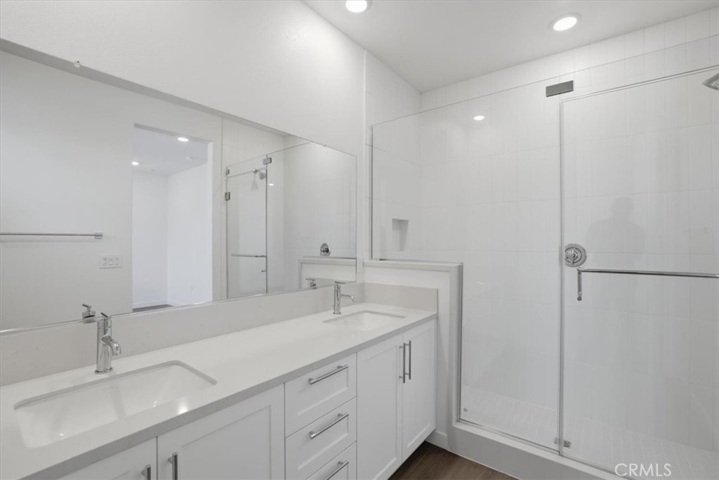2378 Channel Drive, Unit 103 Ventura, CA 93003 - Photo 18 of 33 a bathroom with a sink and a mirror