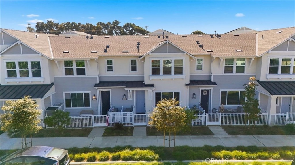 2378 Channel Drive, Unit 103 Ventura, CA 93003 - Photo 2 of 33 a front view of a house with a yard