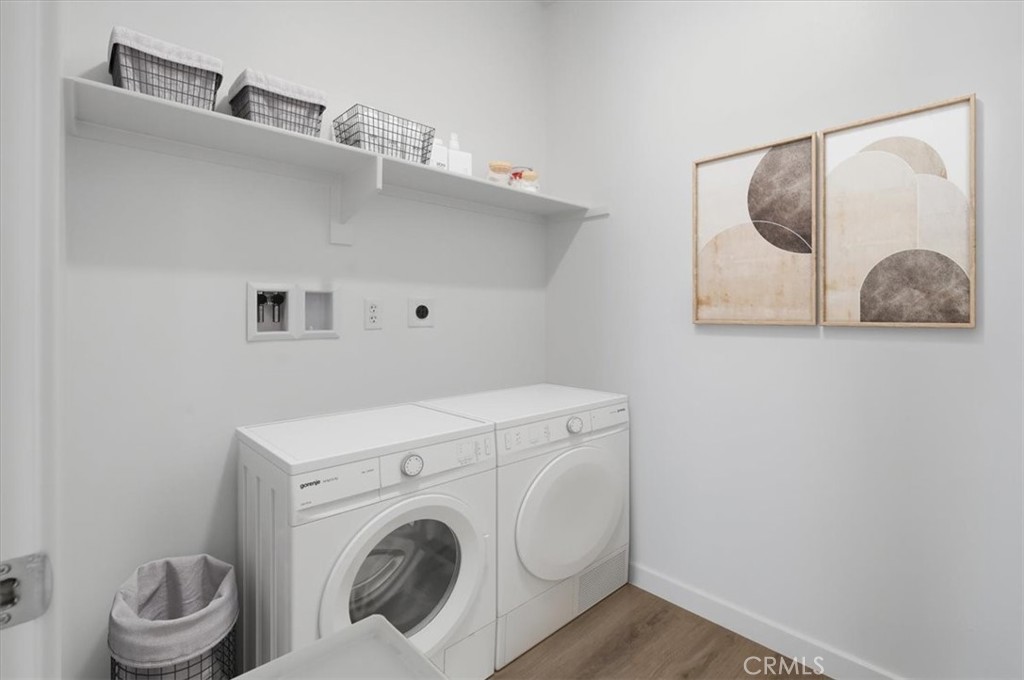 2378 Channel Drive, Unit 103 Ventura, CA 93003 - Photo 22 of 33 a utility room with dryer and washer