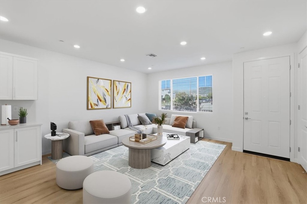 2378 Channel Drive, Unit 103 Ventura, CA 93003 - Photo 6 of 33 a living room with furniture a window and a lamp