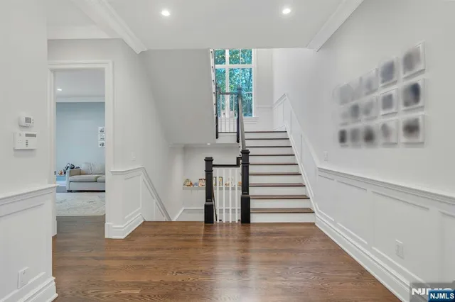 a view of backyard with outdoor seating and trees