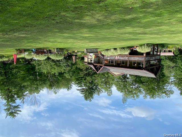 315 Thompsonville Road Monticello, NY 12701 - Photo 4 of 31 a view of a house with a big yard and large trees