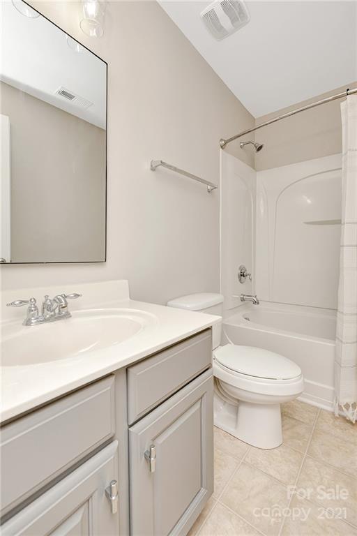 6931 Maricopa Road Charlotte, NC 28277 - Photo 23 of 31 a bathroom with a sink a toilet and a mirror