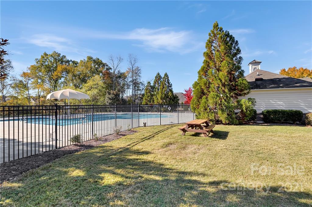 6931 Maricopa Road Charlotte, NC 28277 - Photo 31 of 31 a view of backyard with swimming pool and trees