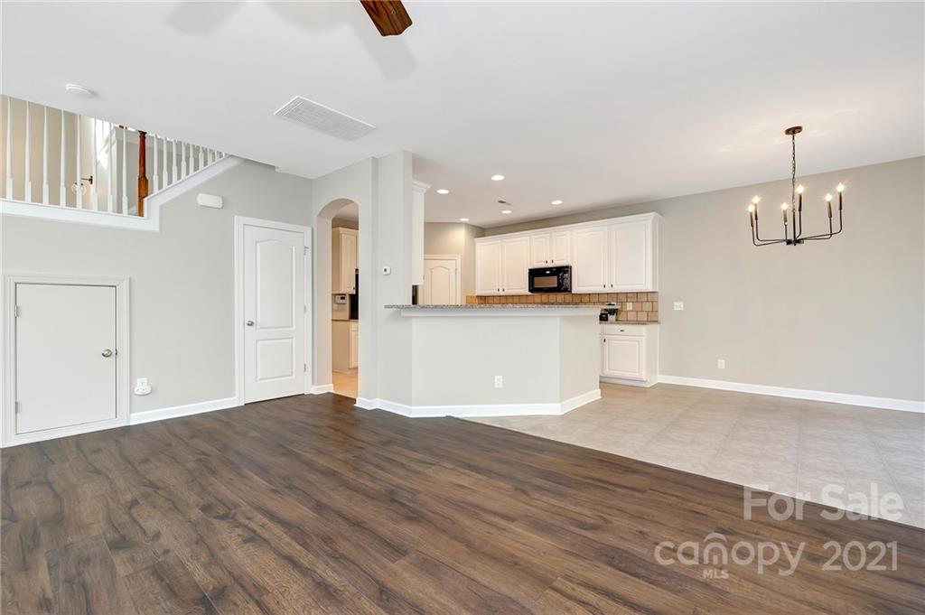 6931 Maricopa Road Charlotte, NC 28277 - Photo 8 of 31 a view of a kitchen with a sink and a refrigerator