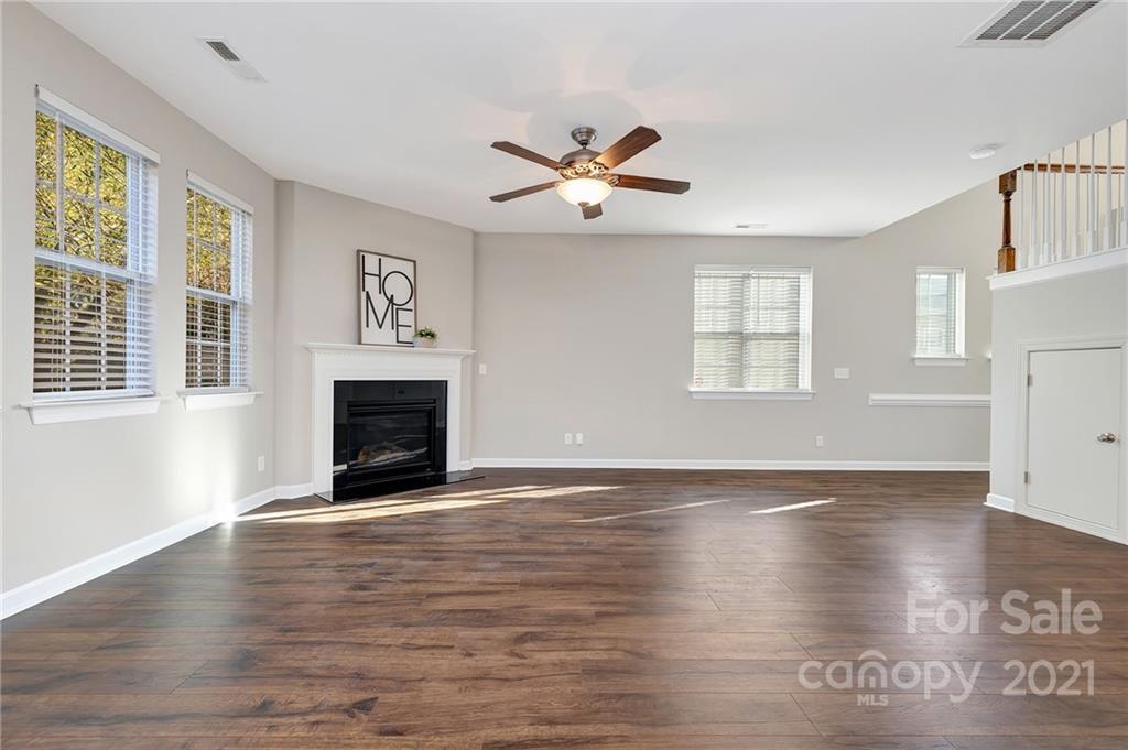 6931 Maricopa Road Charlotte, NC 28277 - Photo 9 of 31 a view of an empty room with window and wooden floor