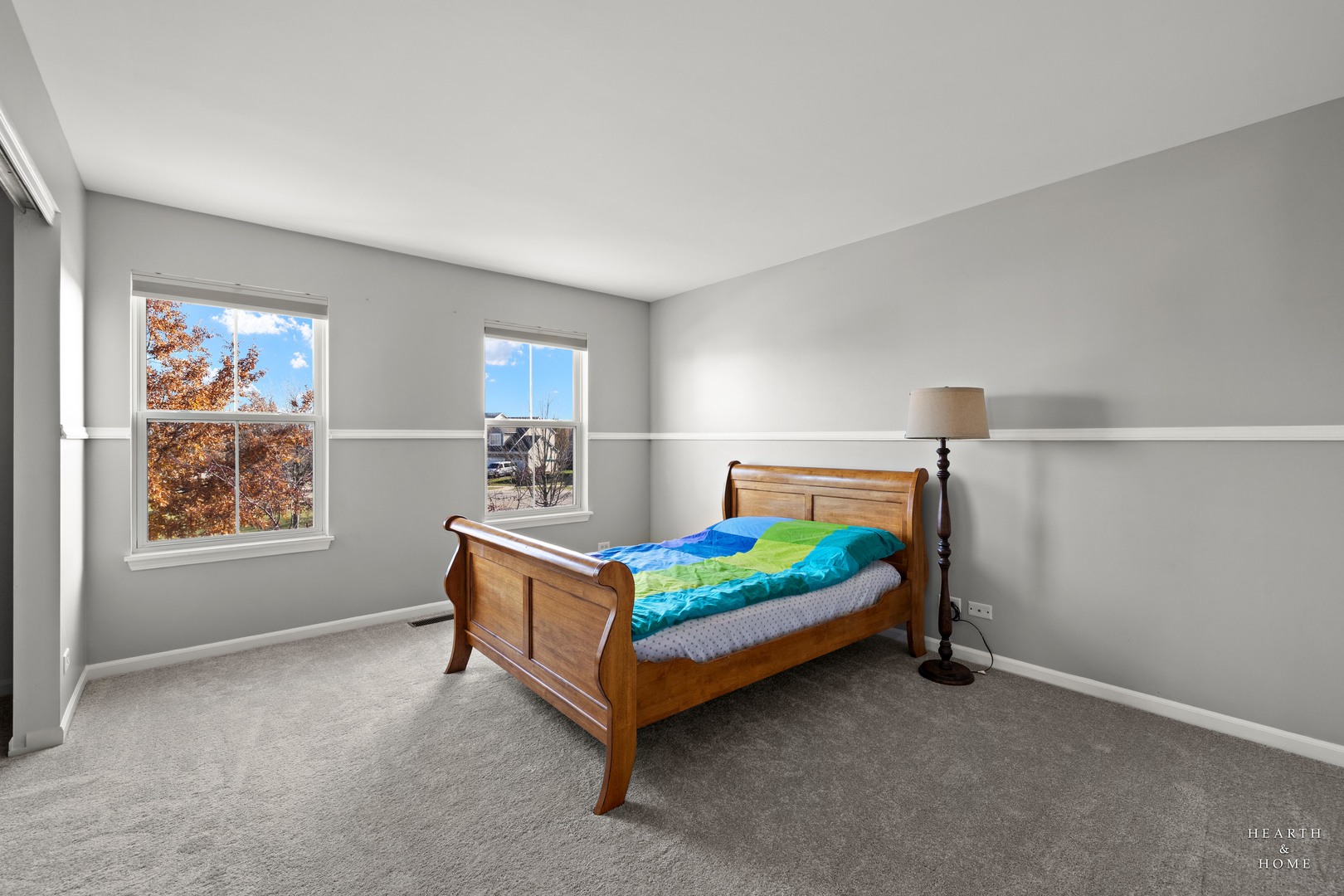 11561 Beacon Avenue Huntley, IL 60142 - Photo 22 of 36 a bedroom with a bed and a window