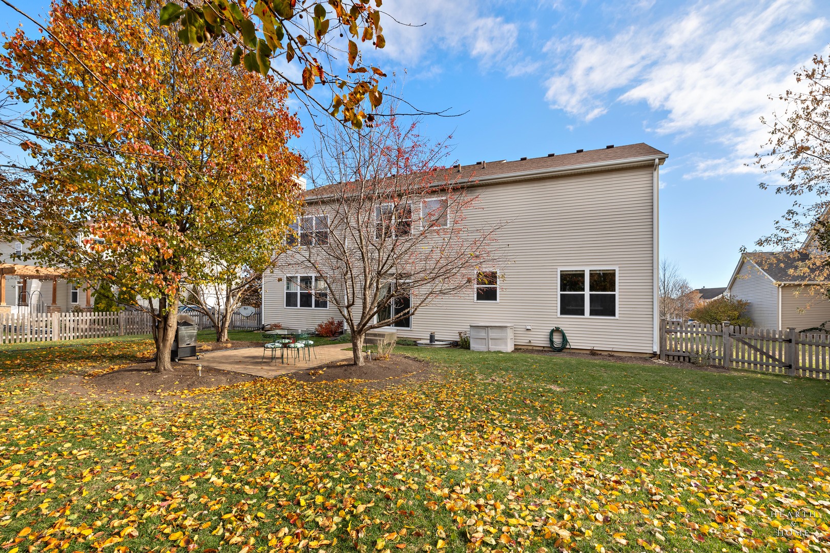 11561 Beacon Avenue Huntley, IL 60142 - Photo 33 of 36 a view of a white house with a yard