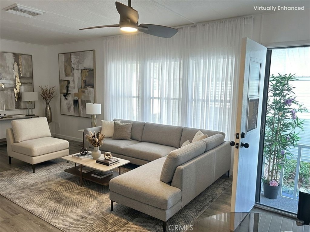 840 East Foothill Boulevard, Unit 144 Azusa, CA 91702 - Photo 3 of 6 a living room with furniture and a large window
