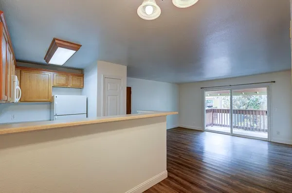 a view of a livingroom with wooden floor