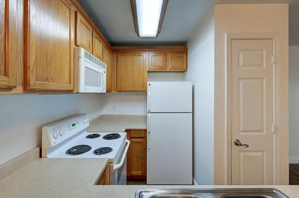 a kitchen with a sink and cabinets