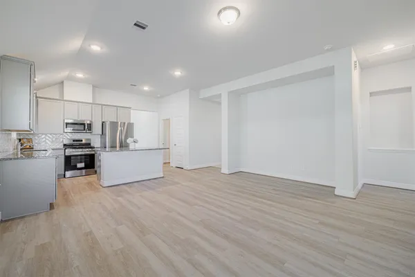 a view of kitchen with wooden floor