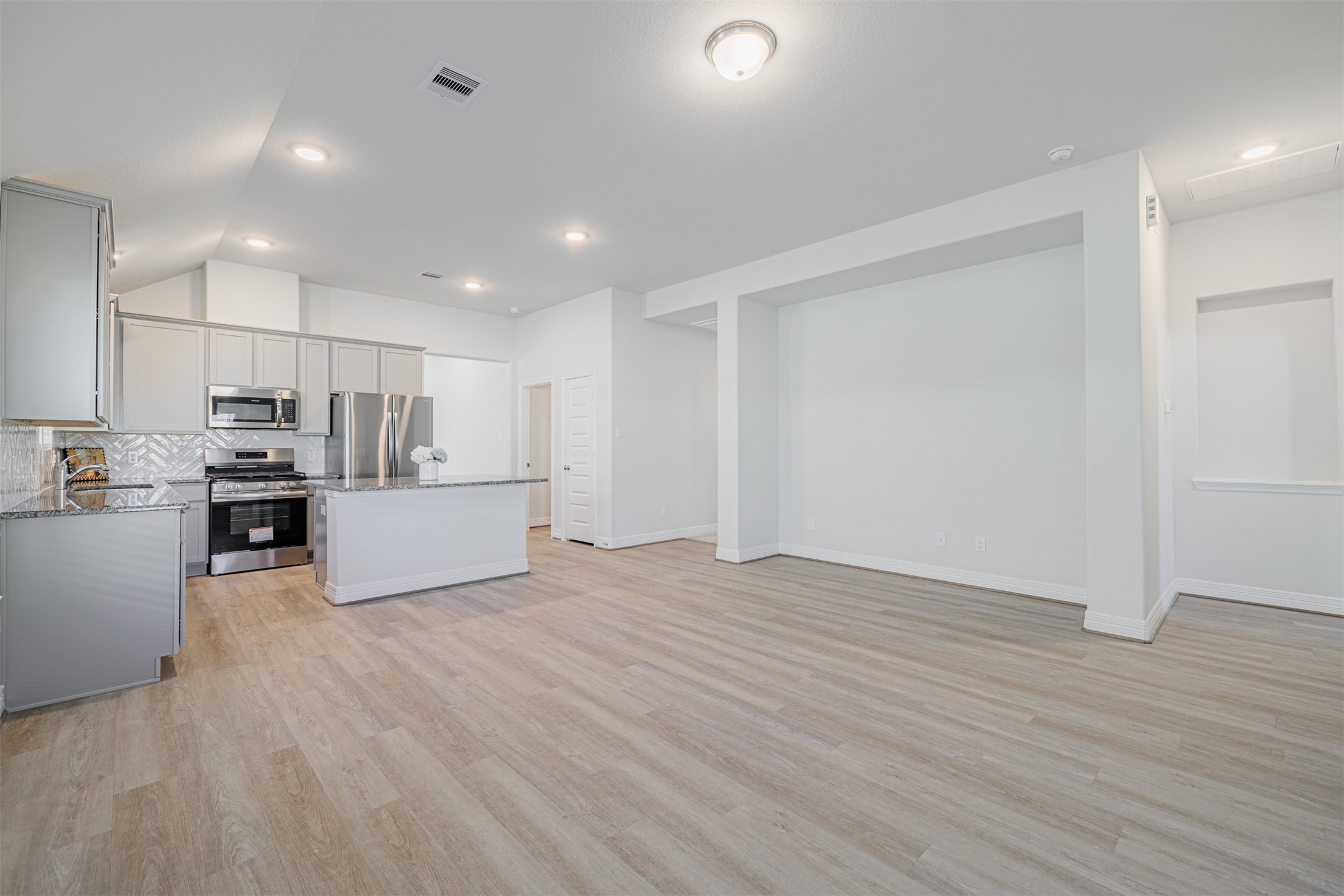 33118 School Hl Road Fulshear, TX 77441 - Photo 11 of 21 a view of kitchen with wooden floor