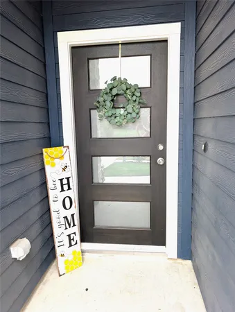 a bathroom with a window and mirror