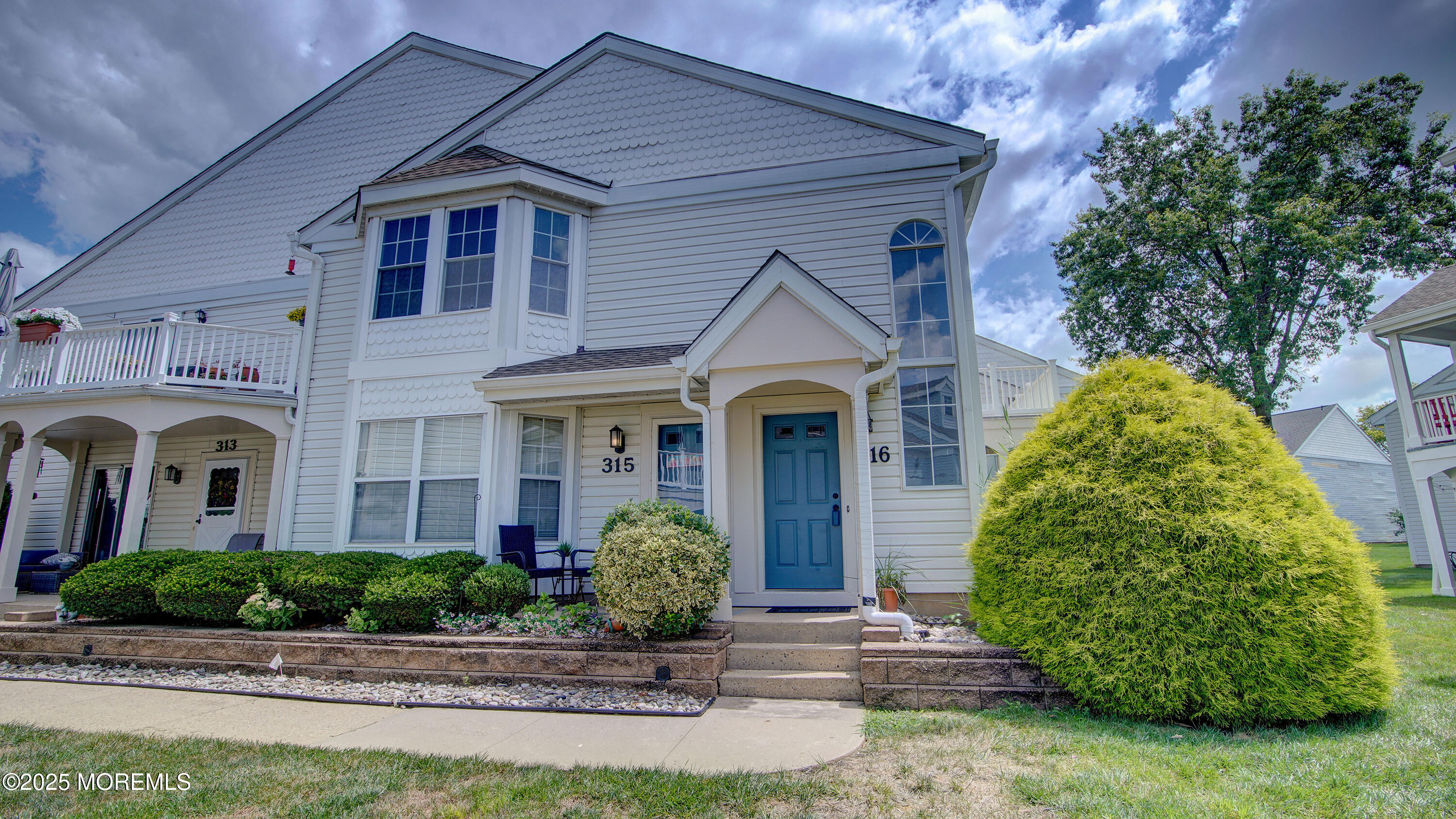 a front view of a house with garden