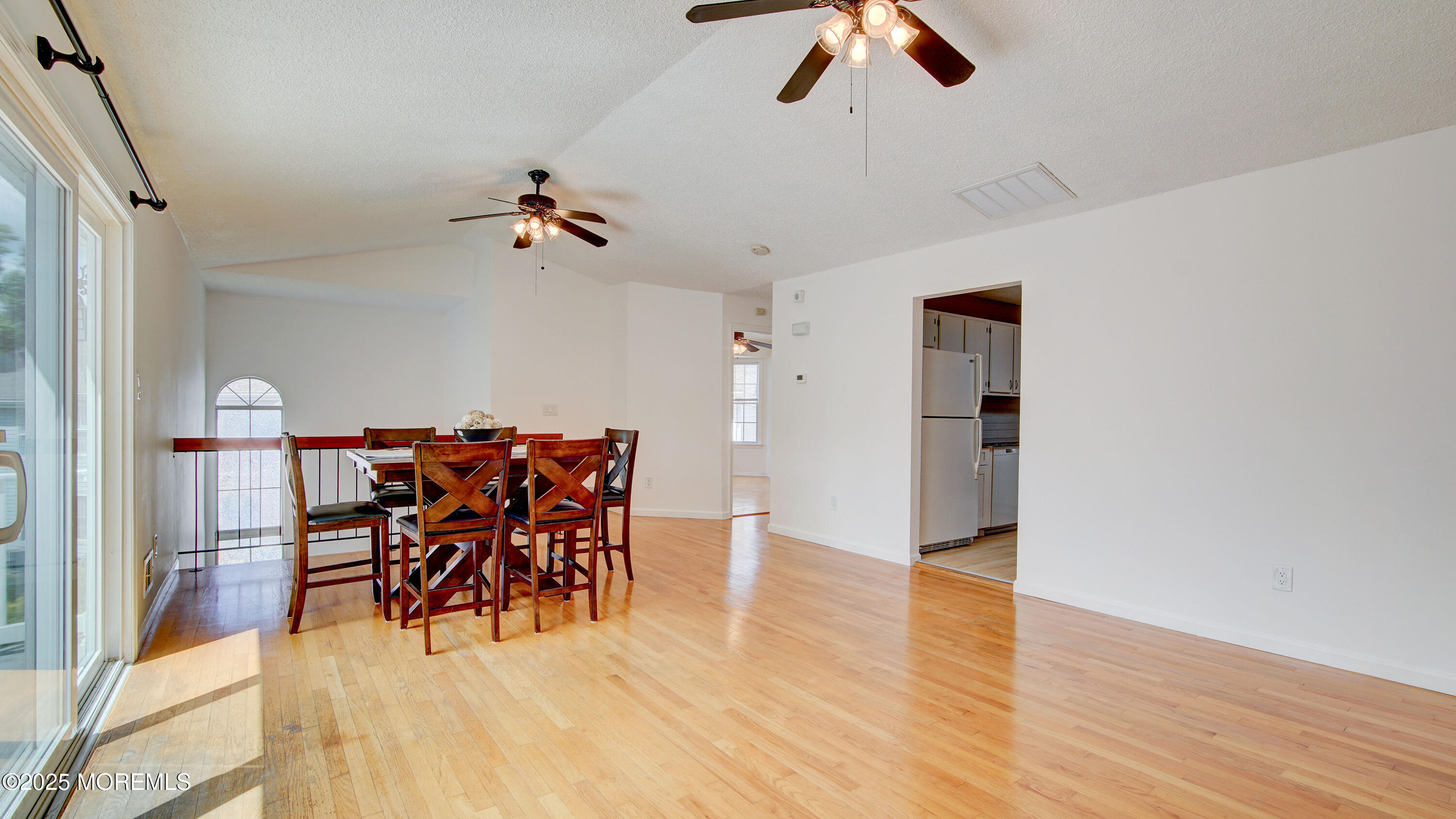 316 Tulip Lane Freehold, NJ 07728 - Photo 11 of 39 a dining room with furniture entryway and wooden floor