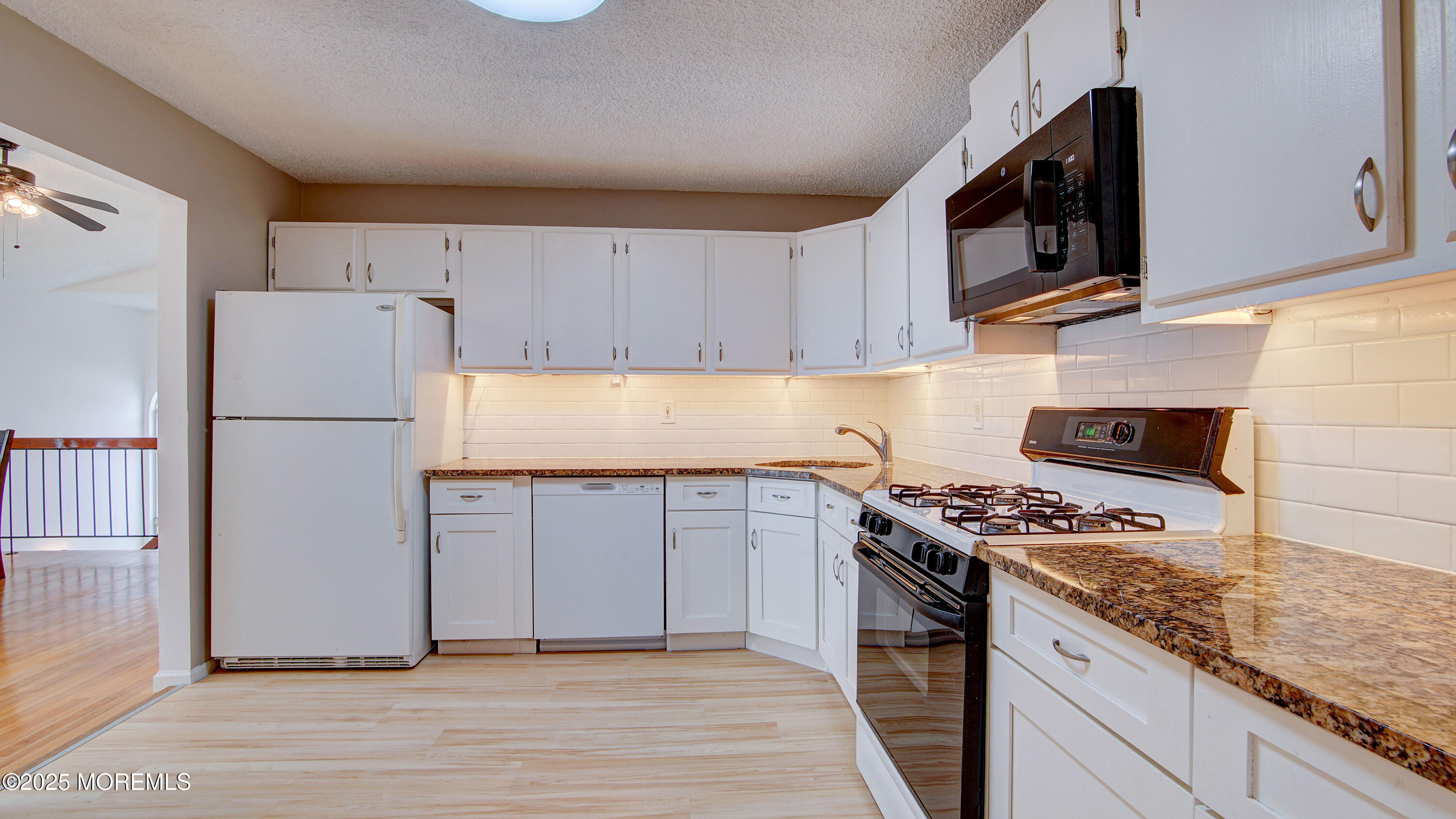 316 Tulip Lane Freehold, NJ 07728 - Photo 19 of 39 a kitchen with stainless steel appliances granite countertop a refrigerator stove a sink and dishwasher