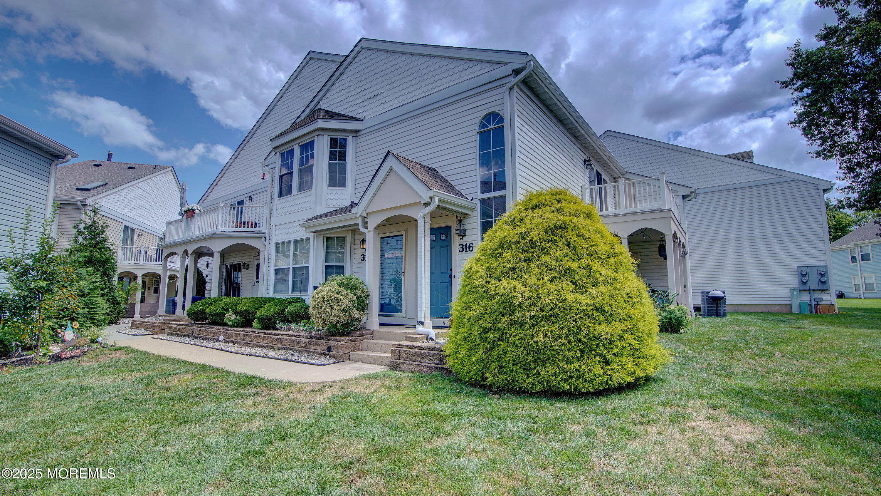 316 Tulip Lane Freehold, NJ 07728 - Photo 2 of 39 a front view of a house with garden