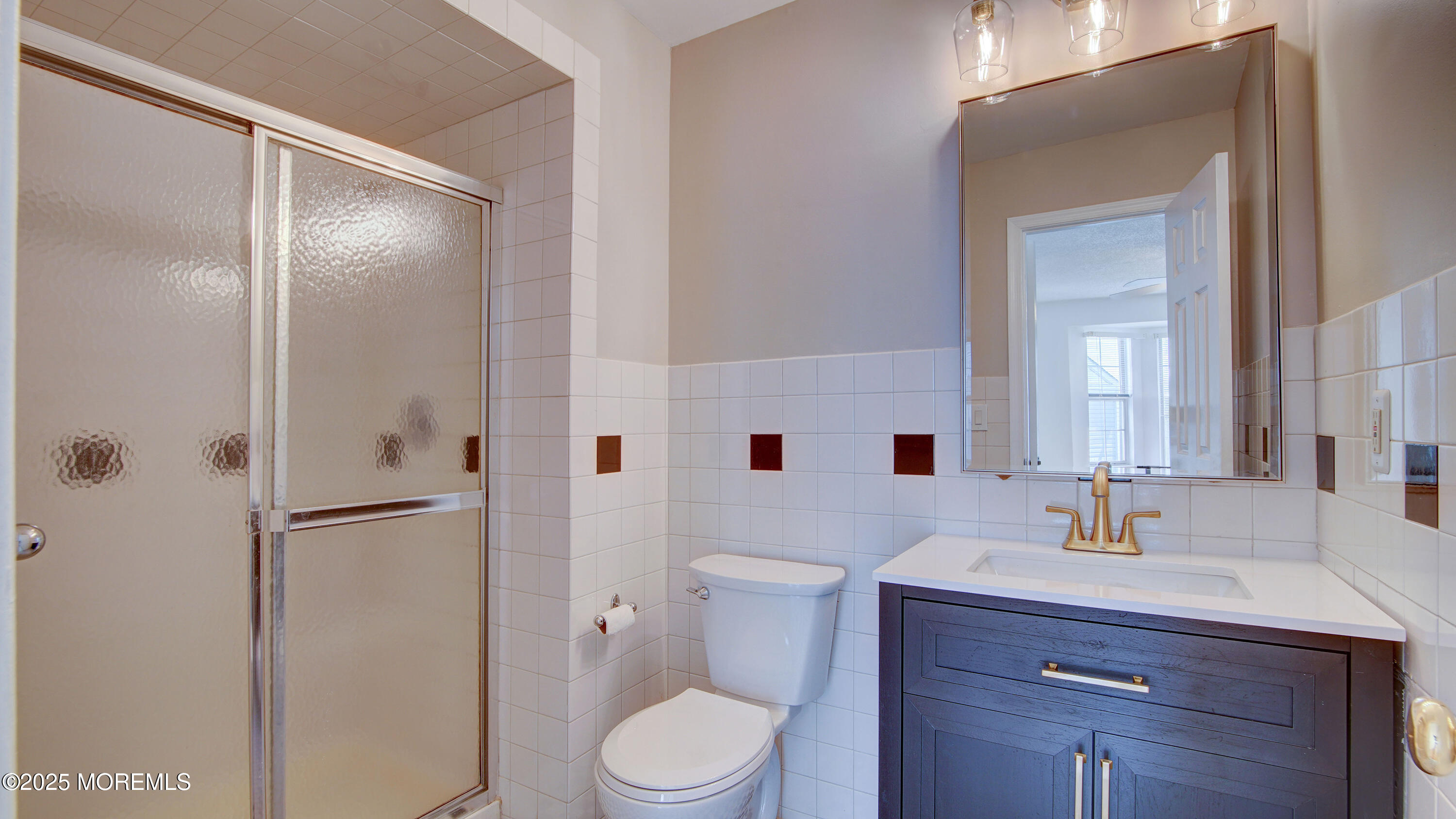 316 Tulip Lane Freehold, NJ 07728 - Photo 26 of 39 a bathroom with a sink a toilet and shower