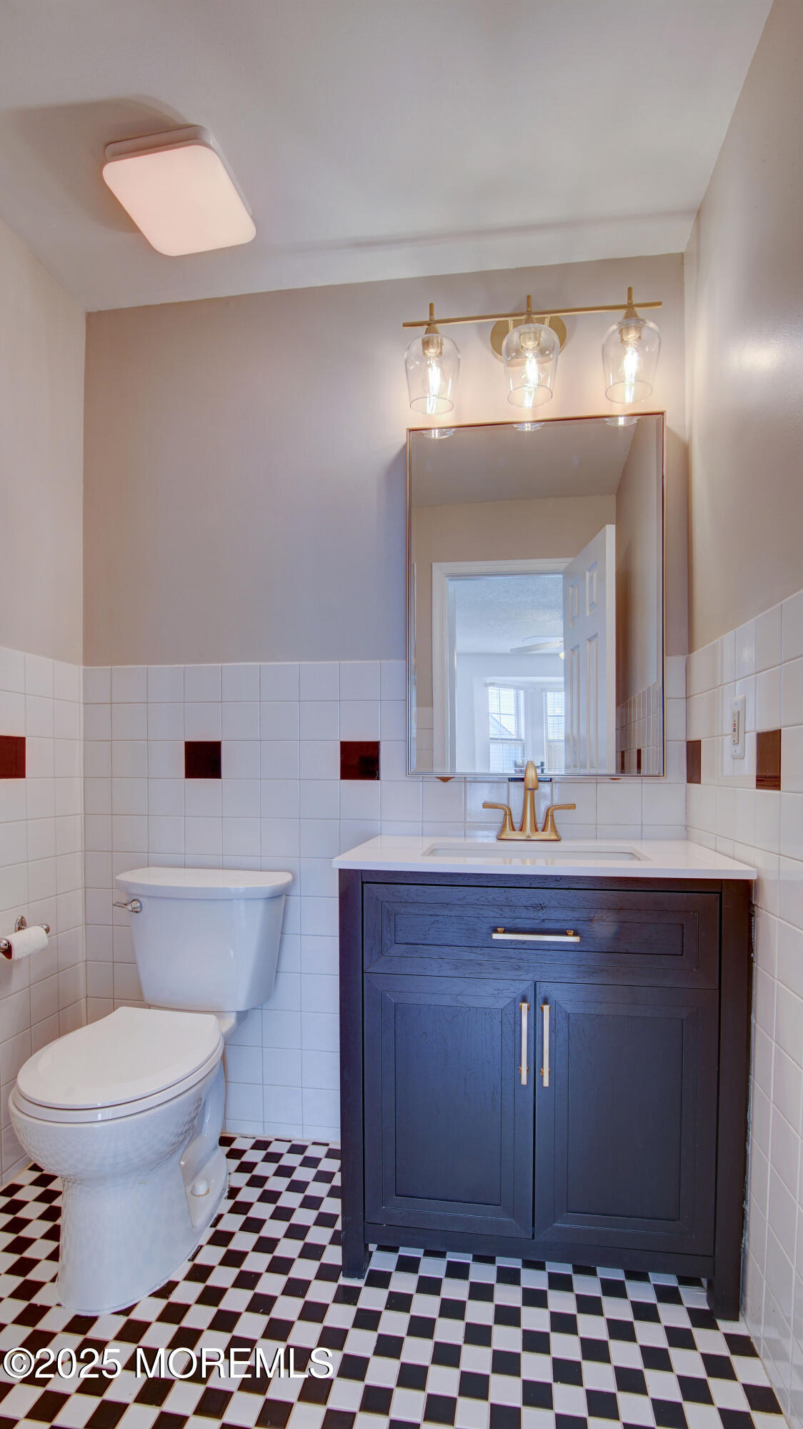 316 Tulip Lane Freehold, NJ 07728 - Photo 27 of 39 a bathroom with a sink a toilet and a mirror