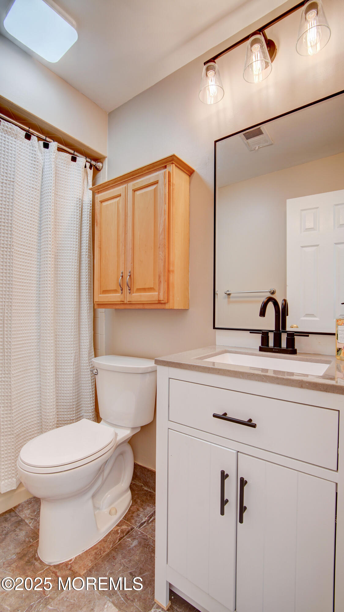 316 Tulip Lane Freehold, NJ 07728 - Photo 32 of 39 a bathroom with a toilet a sink and a mirror