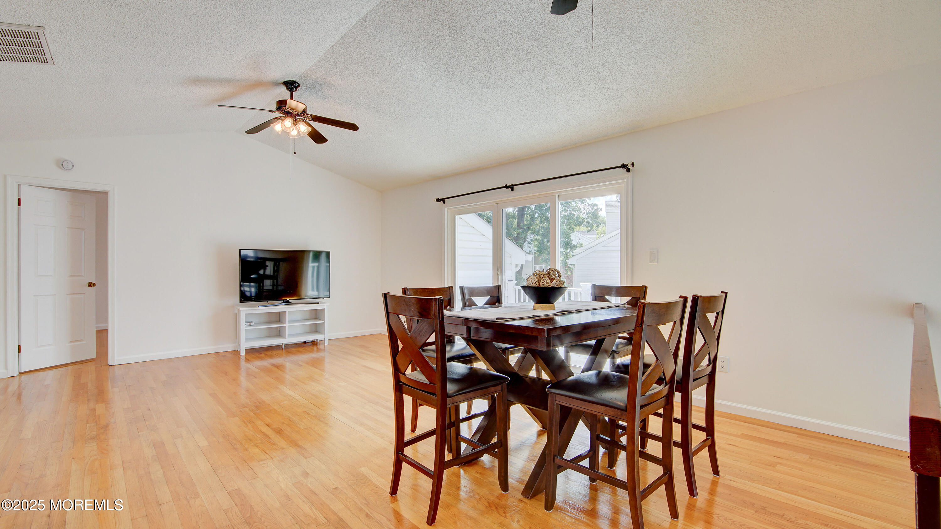 316 Tulip Lane Freehold, NJ 07728 - Photo 8 of 39 a view of a dining room with furniture and wooden floor