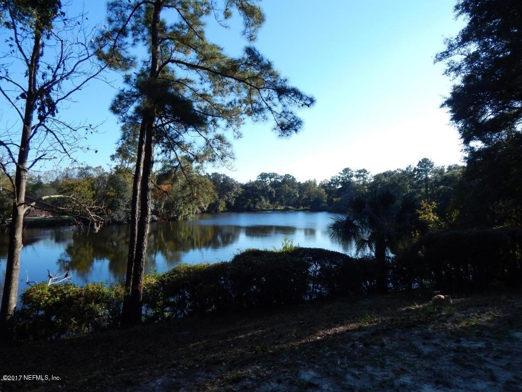 5010 Thorden Road Jacksonville, FL 32207 - Photo 1 of 3 Water view featuring a forest