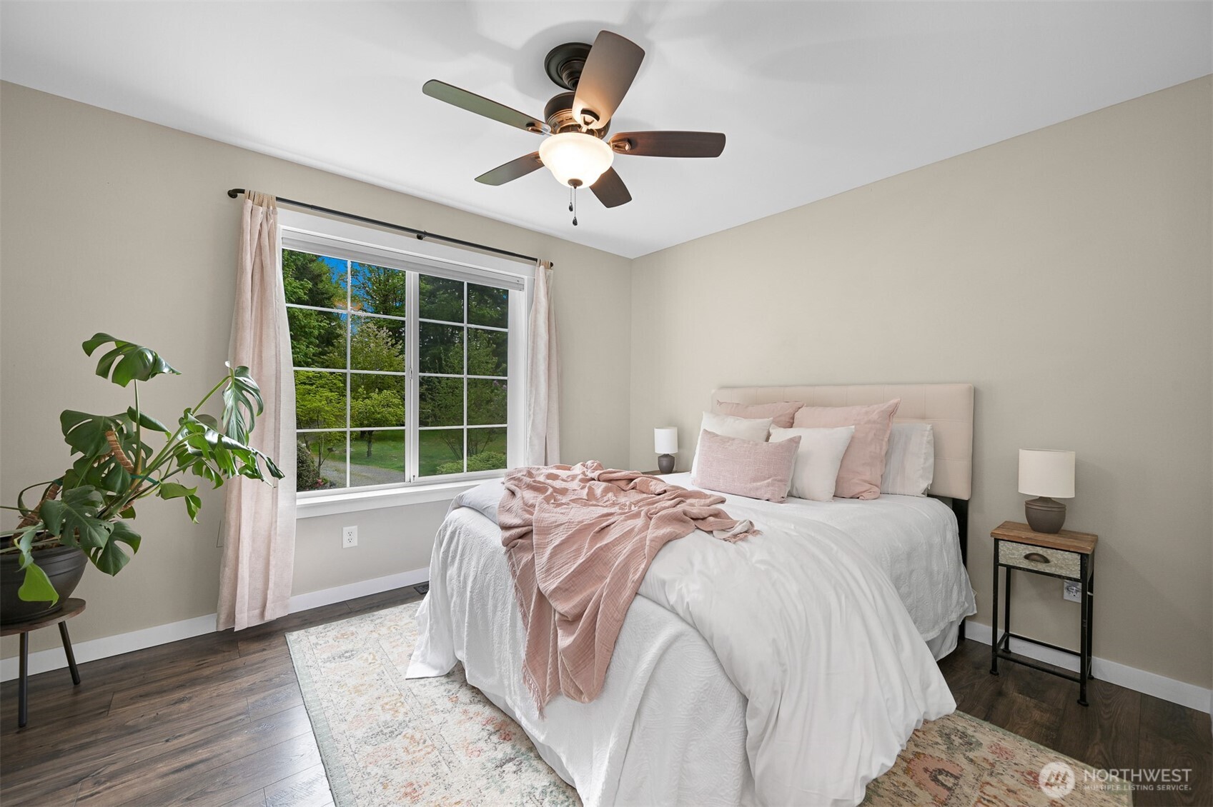 9111 Custer School Road Custer, WA 98240 - Photo 25 of 40 a spacious bedroom with a large bed and a window