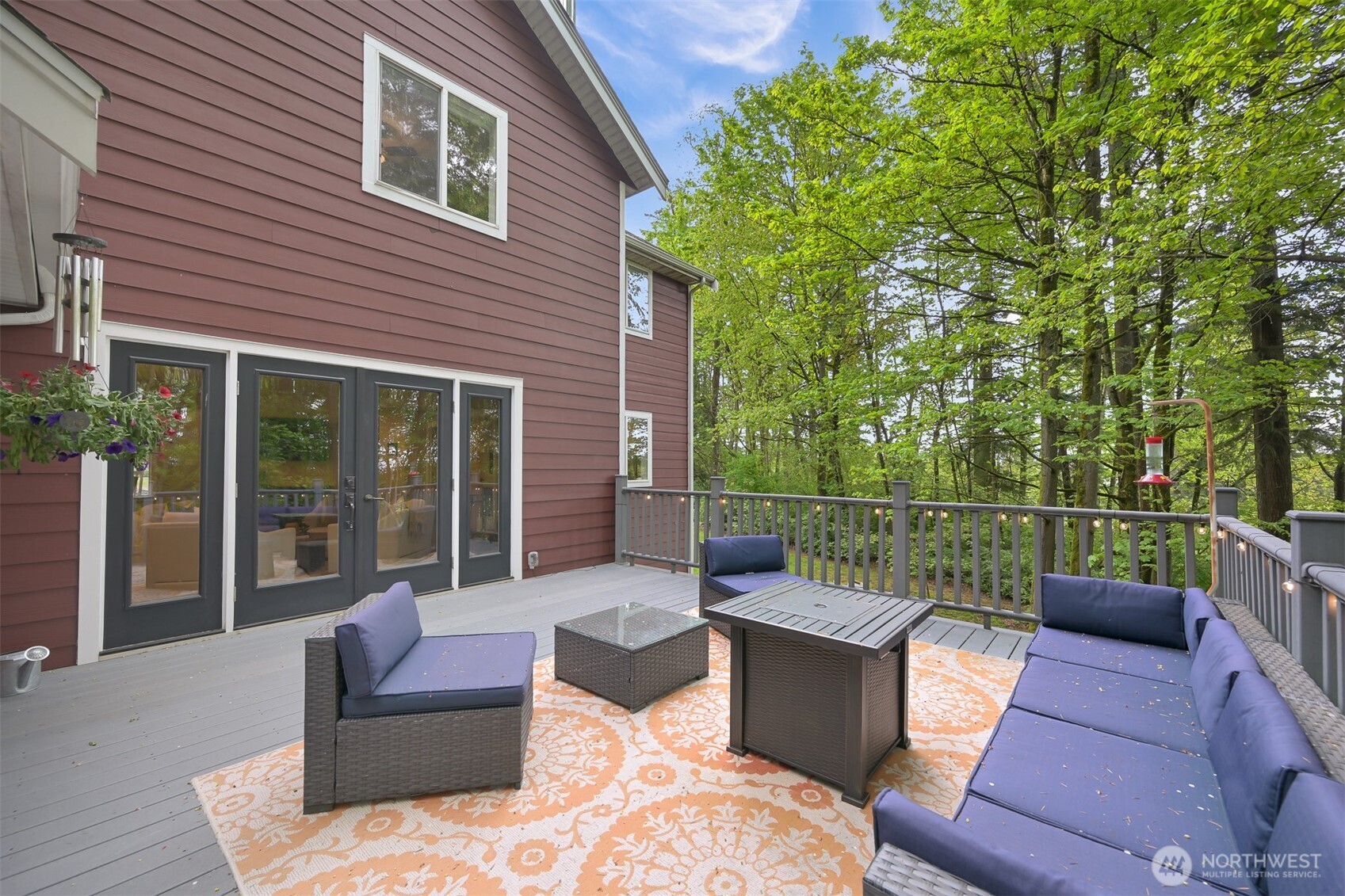 9111 Custer School Road Custer, WA 98240 - Photo 32 of 40 a view of a patio with couches chairs and wooden floor