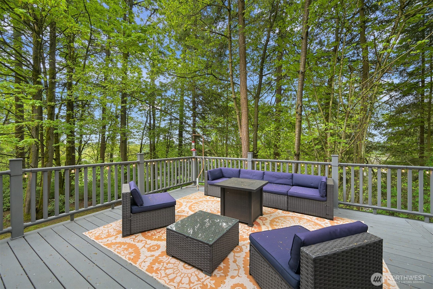 9111 Custer School Road Custer, WA 98240 - Photo 33 of 40 a view of a patio with couches chairs and wooden floor
