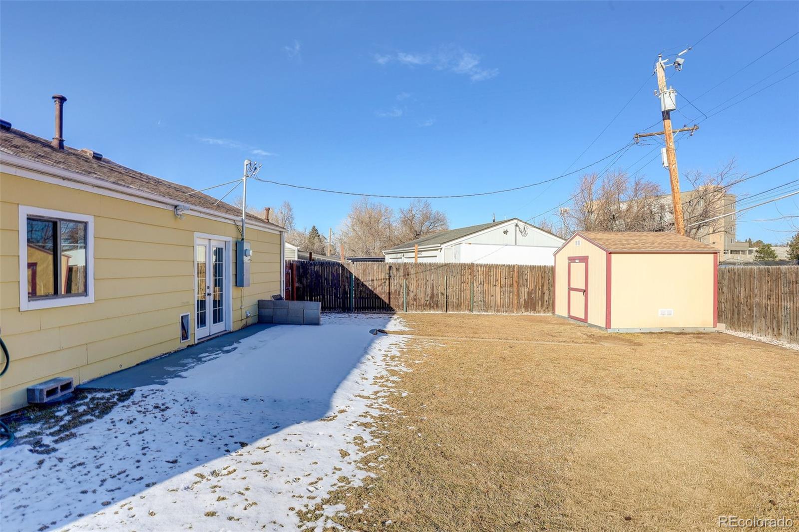 2836 South Grape Way Denver, CO 80222 - Photo 17 of 29 a view of a house with a patio
