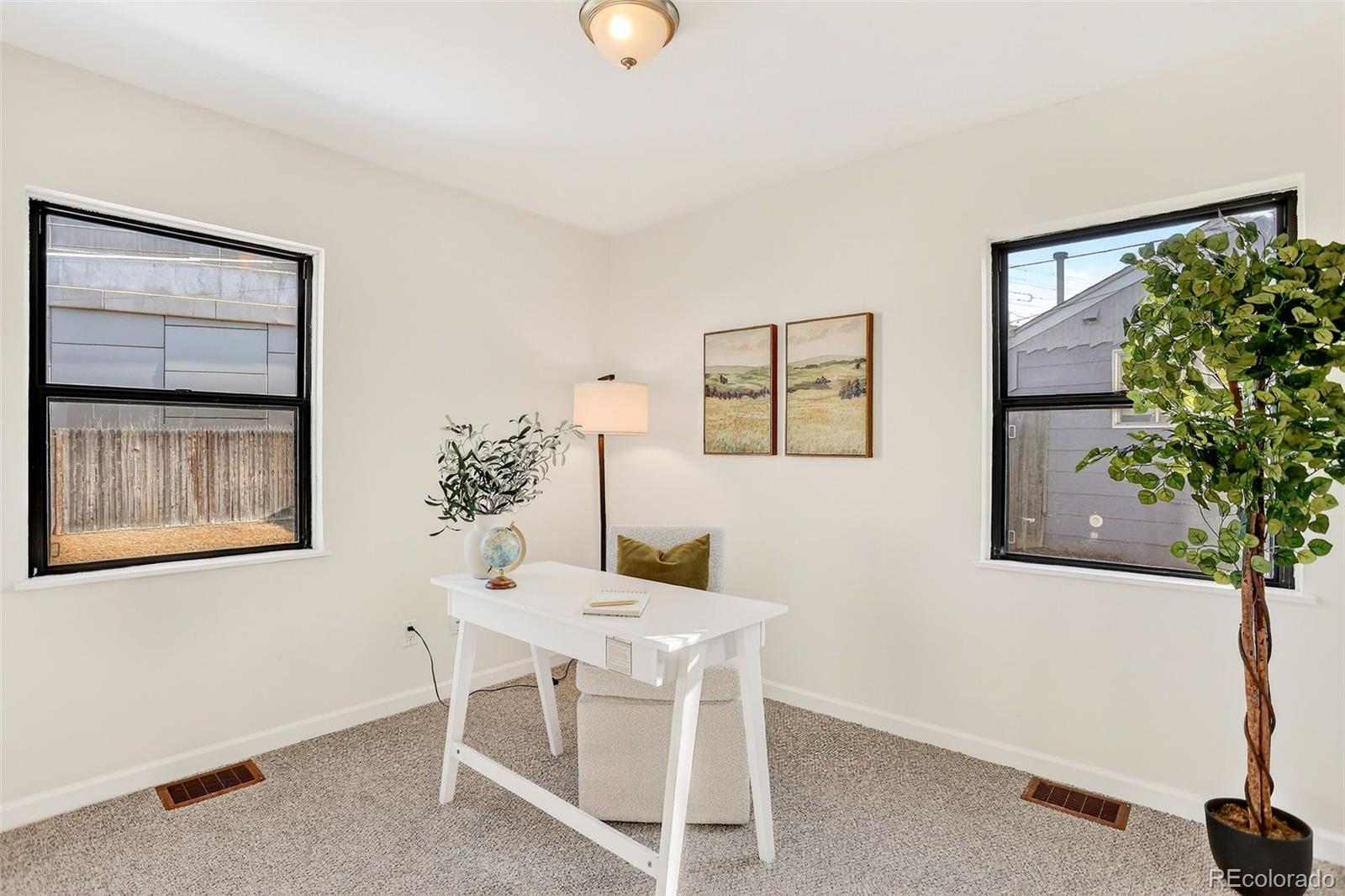 2836 South Grape Way Denver, CO 80222 - Photo 22 of 29 a dining room with furniture and window