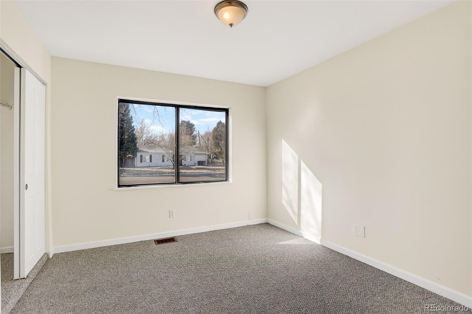 2836 South Grape Way Denver, CO 80222 - Photo 24 of 29 a view of an empty room with a window