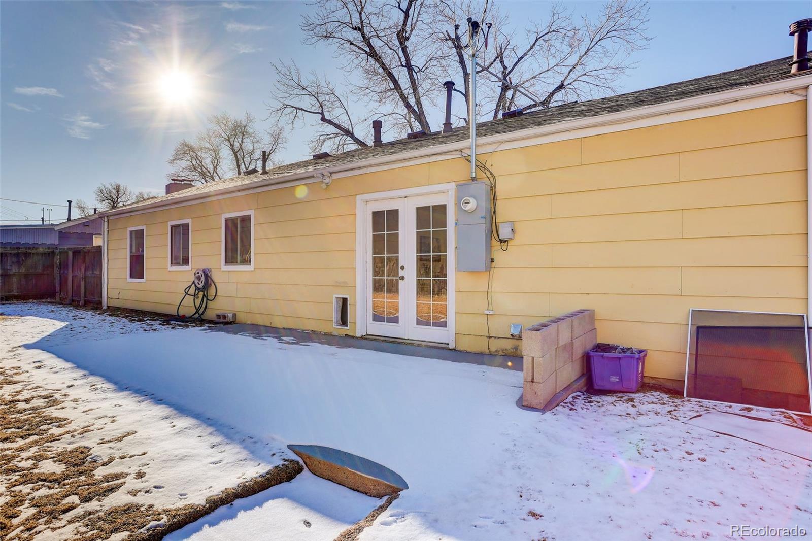 2836 South Grape Way Denver, CO 80222 - Photo 28 of 29 a view of house with backyard