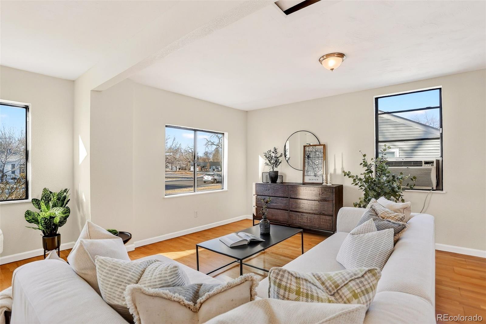 2836 South Grape Way Denver, CO 80222 - Photo 8 of 29 a living room with furniture