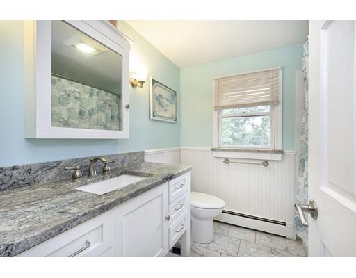 5 Anderson Drive Marshfield, MA 02050 - Photo 17 of 29 a bathroom with a granite countertop sink toilet and painting on the wall