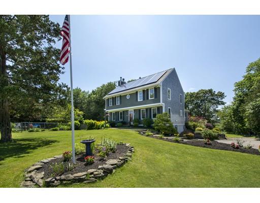 5 Anderson Drive Marshfield, MA 02050 - Photo 2 of 29 a front view of a house with a yard table and chairs