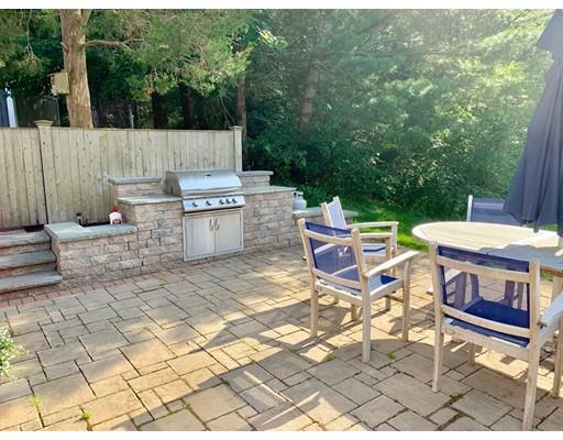 5 Anderson Drive Marshfield, MA 02050 - Photo 24 of 29 a view of a patio with table and chairs with wooden fence
