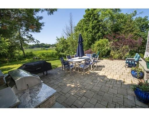 5 Anderson Drive Marshfield, MA 02050 - Photo 25 of 29 a view of a patio with table and chairs potted plants with wooden floor