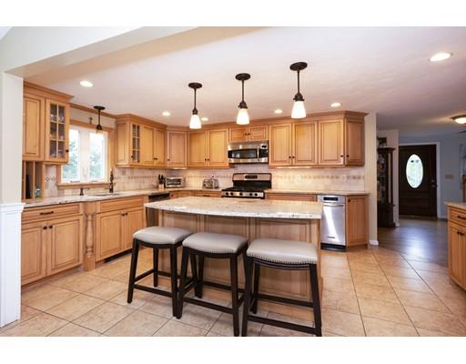 5 Anderson Drive Marshfield, MA 02050 - Photo 4 of 29 a kitchen with kitchen island granite countertop wooden cabinets and counter space