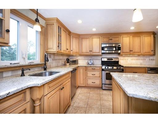 5 Anderson Drive Marshfield, MA 02050 - Photo 5 of 29 a kitchen with kitchen island granite countertop a sink appliances cabinets and a counter top space