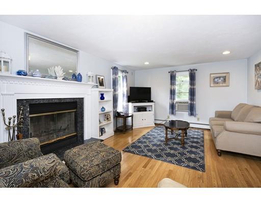 5 Anderson Drive Marshfield, MA 02050 - Photo 10 of 29 a living room with furniture and a fireplace