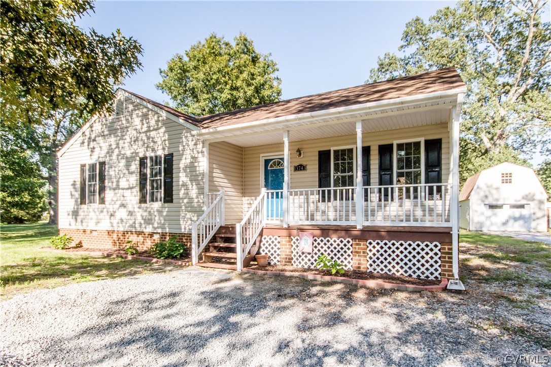 13743 Harrowgate Road Chester, VA 23831 - Photo 1 of 26 a front view of a house with a yard