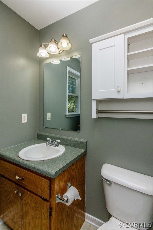 13743 Harrowgate Road Chester, VA 23831 - Photo 16 of 26 a bathroom with a sink and a mirror