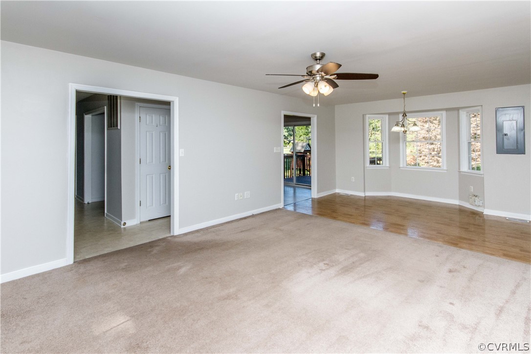 13743 Harrowgate Road Chester, VA 23831 - Photo 6 of 26 a view of a livingroom with a ceiling fan and window